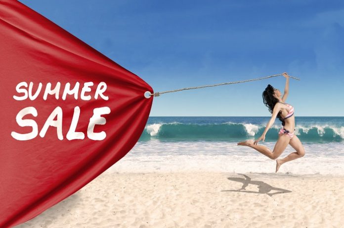 Woman pulling a banner of summer sale