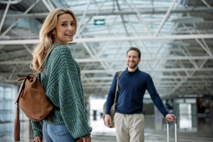 Content woman and man standing in the hall İstanbul’dan Uçakla Gidebileceğiniz Tatil Rotaları