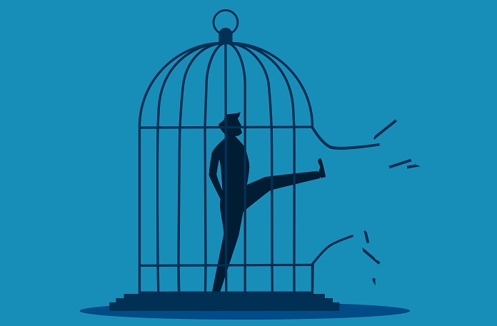 Freedom. Businessman breaking the cage