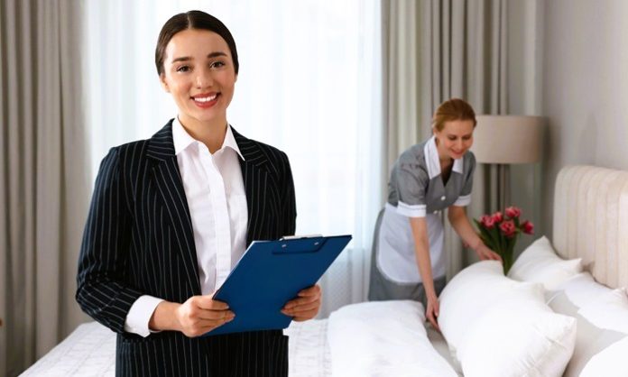 otel, çalışan, Housekeeping manager with clipboard checking maid's work in hotel bedroom